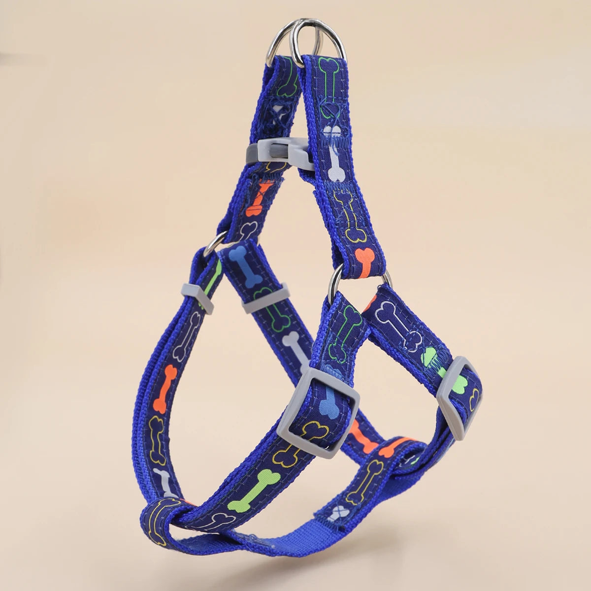 A colorful bone tripod pet dog harness for indoor and outdoor